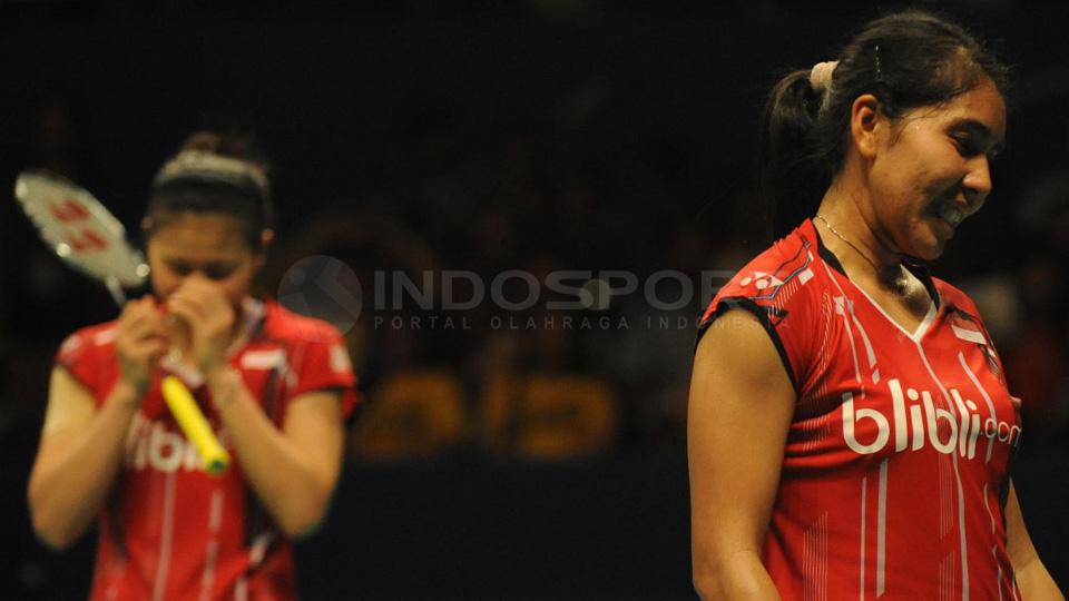 Nitya Krishinda tetap tersenyum setelah dikalahkan pasangan Jinhua Tang/ Qing Tian dalam BCA Indonesia Open 2015 yang didukung oleh Bakti Olahraga Djarum Foundation. Minggu (07/06/2015). - INDOSPORT